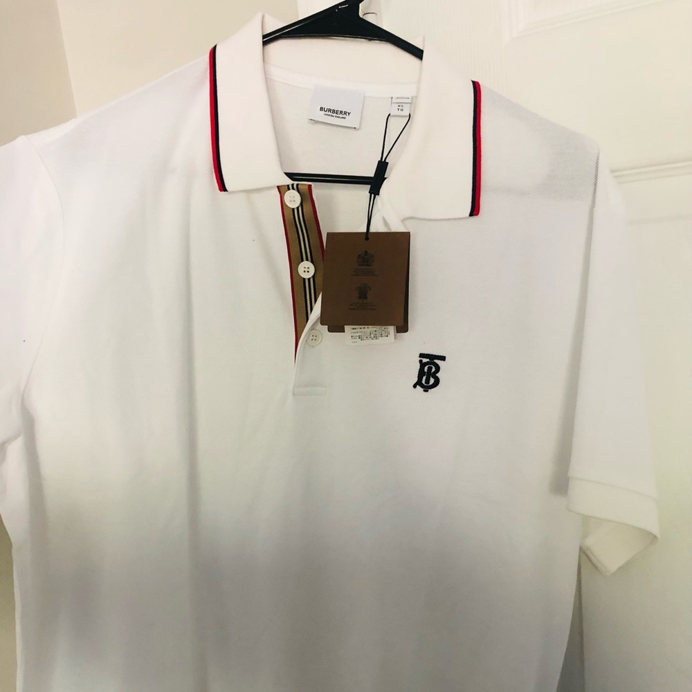 Crisp, unworn w/tags Burberry white polo w/black logo